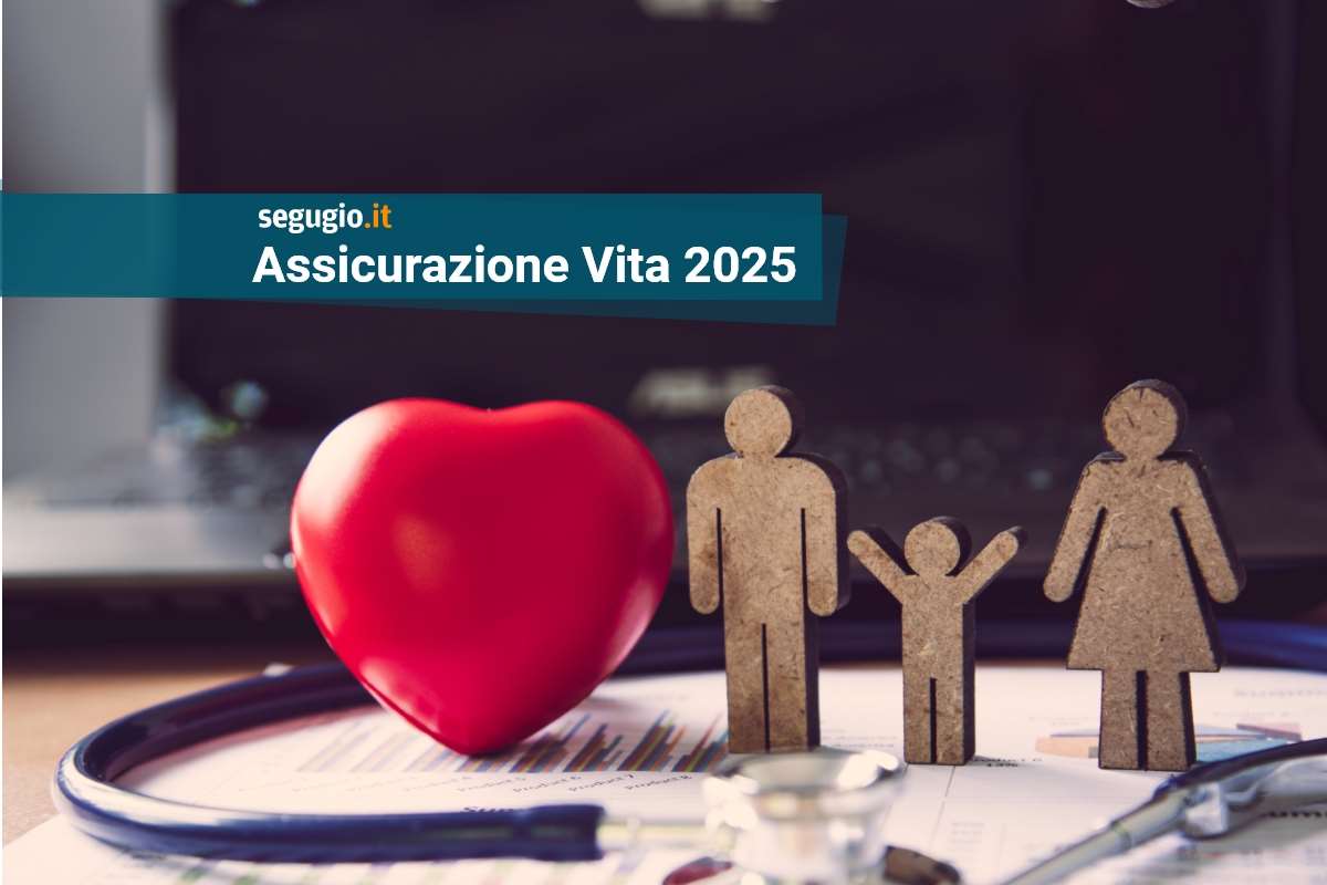 figure in legno dei componenti di una famiglia, cuore e stetoscopio